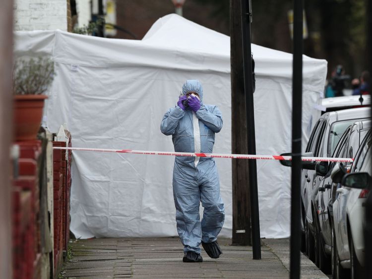 A forensic officer on Chalgrove Road, where the victim died