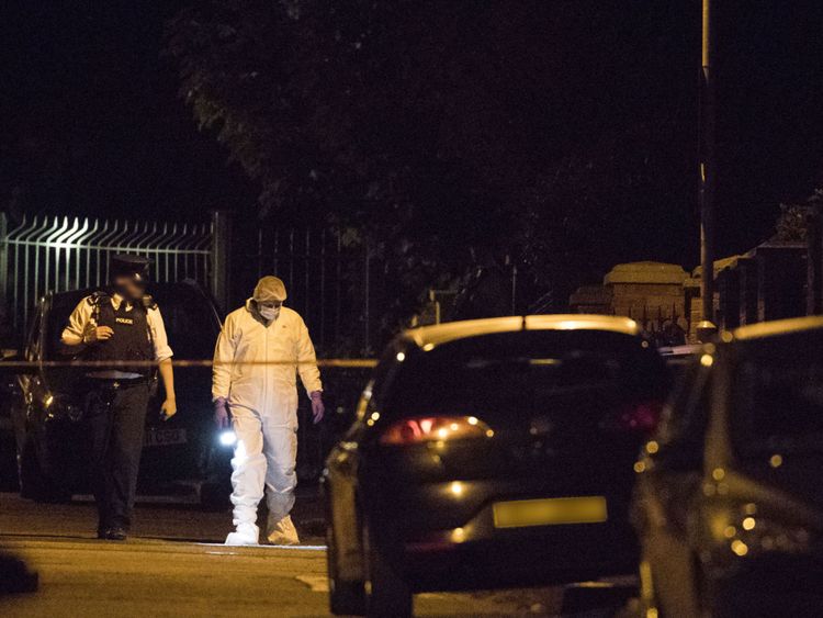 Police and forensic investigators at the scene of Gerry Adams house