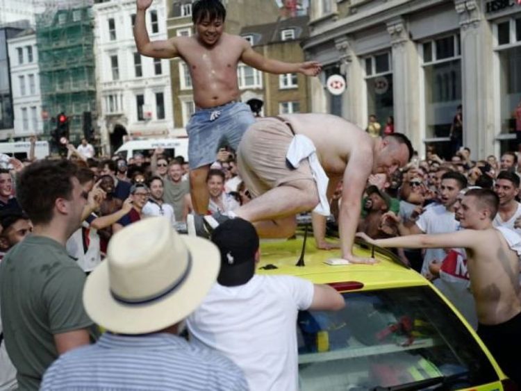 Two half-naked men were dancing on the roof