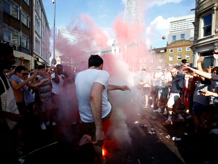 England fans set off smoke bombs after the match