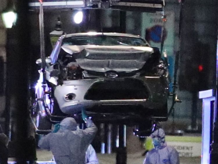 Police recover the car driven by a 29-year-old man, who is a UK national, who was arrested on suspicion of preparing an act of terror after the silver Ford Fiesta he was driving collided with cyclists and pedestrians before crashing into a security barrier outside the Houses of Parliament in central London just before 7.40am on Tuesday.
