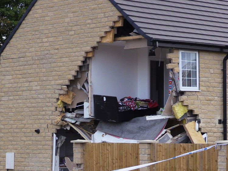 A bedroom in the house has been fully exposed by the collision
