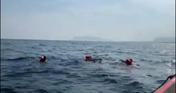 Desperate migrants jump overboard from charity boat off Italy